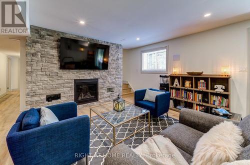 214 Desroches Trail, Tiny, ON - Indoor Photo Showing Living Room With Fireplace