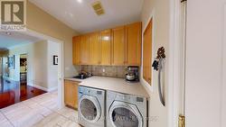 Main floor laundry with walk in closet - 