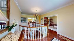 Spacious foyer with circular stairs to basement - 