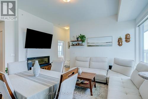 1413 - 30 Shore Breeze Drive, Toronto, ON - Indoor Photo Showing Other Room With Fireplace