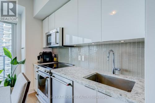 1413 - 30 Shore Breeze Drive, Toronto, ON - Indoor Photo Showing Kitchen With Upgraded Kitchen