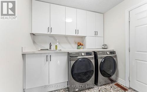 Main Floor Laundry with Quartz Countertops - 1665 Asgard Drive, Mississauga, ON - Indoor Photo Showing Laundry Room