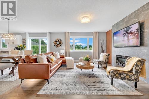 135 Stephenson Way, Minto, ON - Indoor Photo Showing Living Room With Fireplace
