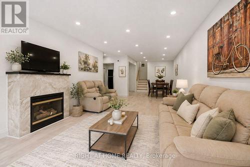 Virtually Staged Living Room - 1147 Saturnia Crescent, Mississauga, ON - Indoor Photo Showing Living Room With Fireplace