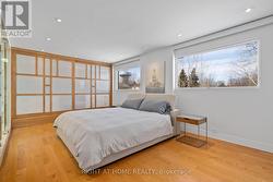 Primary Bedoom with Wall of Closets - 