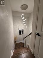 Lovely Chandelier in stairway to Lower Level. - 