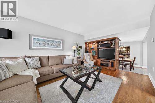 Open-concept living space with wood-finish flooring - 30 Carriagegate Drive, Hamilton, ON - Indoor Photo Showing Living Room