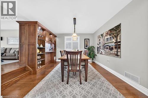 Formal dining area featuring rich wood-finish flooring - 30 Carriagegate Drive, Hamilton, ON - Indoor Photo Showing Dining Room