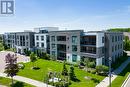 318 - 40 Via Rosedale, Brampton, ON  - Outdoor With Balcony With Facade 