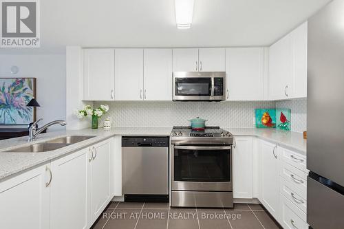 318 - 40 Via Rosedale, Brampton, ON - Indoor Photo Showing Kitchen With Stainless Steel Kitchen With Double Sink
