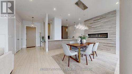 1305 - 39 Queens Quay E, Toronto, ON - Indoor Photo Showing Dining Room With Fireplace