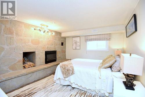 4299 Lakeshore Road, Burlington, ON - Indoor Photo Showing Bedroom With Fireplace