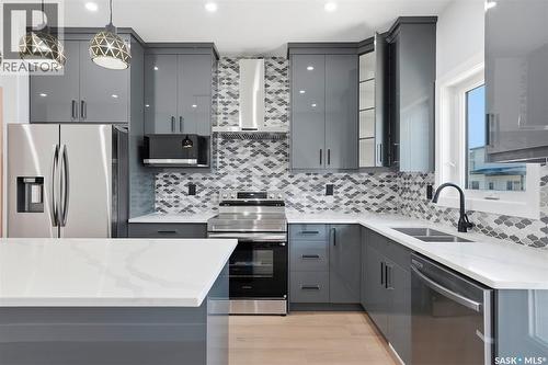 150 Sharma Lane, Saskatoon, SK - Indoor Photo Showing Kitchen With Double Sink With Upgraded Kitchen