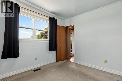 Room with light blue walls, white trim, and light grey carpet flooring - 958 Highland Road E, Hamilton, ON 