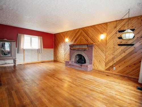 8 Allison Avenue, Amherst, NS - Indoor Photo Showing Living Room With Fireplace