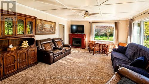640 Tiny Beaches Road N, Tiny, ON - Indoor Photo Showing Living Room With Fireplace