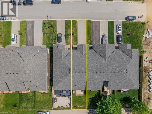 Aerial view showcasing a residential property with a shingled roof and a rear patio space - 107 Stephenson Way, Palmerston, ON - 