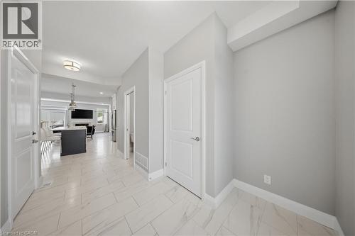 Tiled entryway featuring light-colored flooring, neutral wall tones, and white trim - 107 Stephenson Way, Palmerston, ON - Indoor Photo Showing Other Room