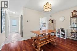 Rich wood-finish flooring complements the neutral wall tones - 
