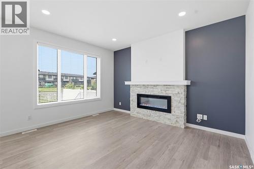 104 Forsey Avenue, Saskatoon, SK - Indoor Photo Showing Living Room With Fireplace