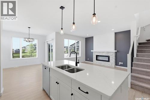 104 Forsey Avenue, Saskatoon, SK - Indoor Photo Showing Kitchen With Fireplace With Double Sink