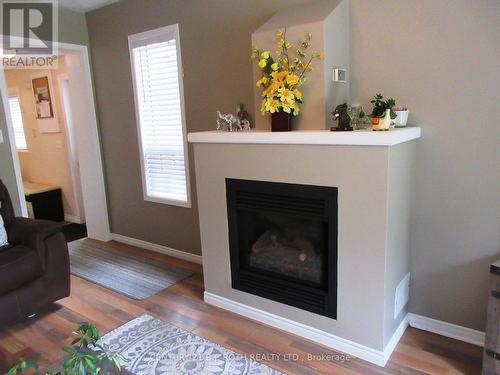31 River Drive, Essa, ON - Indoor Photo Showing Living Room With Fireplace