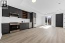 Open-concept living area featuring wood-finish flooring and recessed lighting - 146 Everett Common, St. Catharines, ON  - Indoor Photo Showing Other Room 