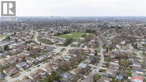 Established residential area featuring detached homes, townhomes, and a central green space with sports fields - 60 Lysanda Avenue, London, ON - Outdoor With View