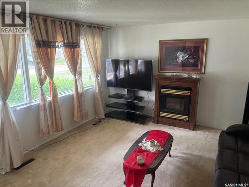 127 Walden Crescent, Regina, SK - Indoor Photo Showing Living Room With Fireplace