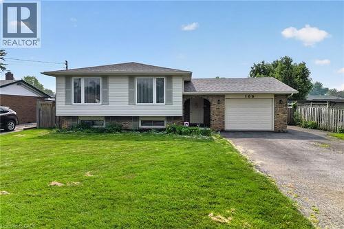 Split-level residence featuring white siding and brick accents - 186 Glenmor Drive, Caledonia, ON - Outdoor