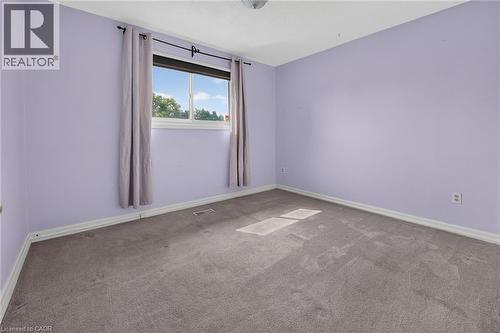 Room with light purple walls and gray carpet flooring - 186 Glenmor Drive, Caledonia, ON - Indoor Photo Showing Other Room
