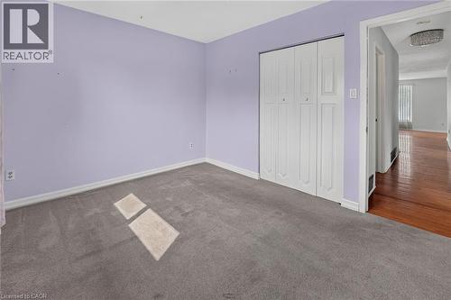 Room featuring soft lavender walls and gray carpet flooring - 186 Glenmor Drive, Caledonia, ON - Indoor Photo Showing Other Room