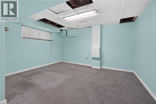 Spacious interior with light blue walls and gray carpeting - 186 Glenmor Drive, Caledonia, ON - Indoor Photo Showing Other Room