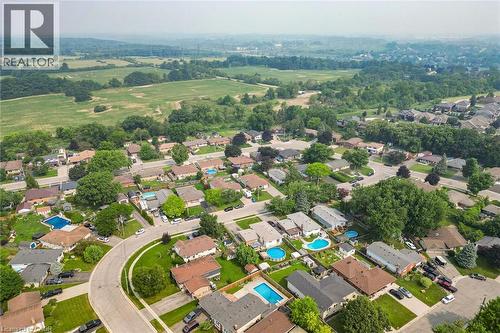 Residential neighborhood featuring mature trees, curved streetscapes, and various property styles - 186 Glenmor Drive, Caledonia, ON - Outdoor With View