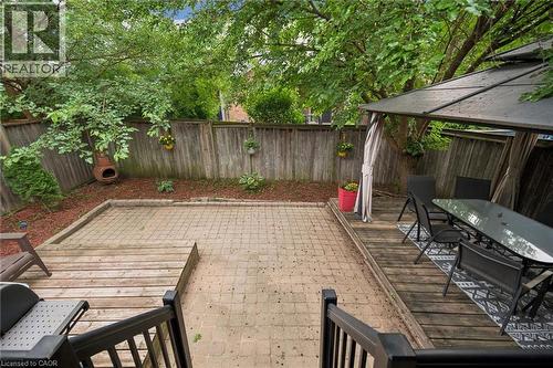 Multi-level backyard featuring a paver patio and a wood deck with a privacy gazebo - 23 Knack Lane, Cambridge, ON - Outdoor