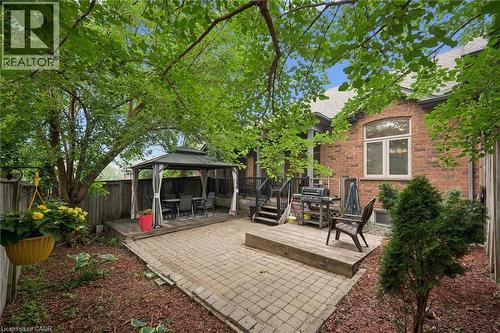 Private backyard featuring a paver patio and a raised wooden deck with a gazebo - 23 Knack Lane, Cambridge, ON - Outdoor