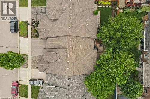 Residential property featuring a shingled roofline, multiple gables, and mature trees - 23 Knack Lane, Cambridge, ON - Outdoor