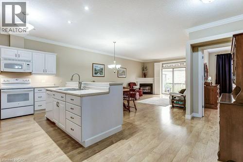 20 Isherwood Avenue Unit# 109, Cambridge, ON - Indoor Photo Showing Kitchen With Fireplace With Double Sink