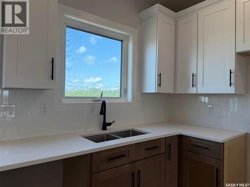 11 Aspen Place, Humboldt, SK - Indoor Photo Showing Kitchen With Double Sink