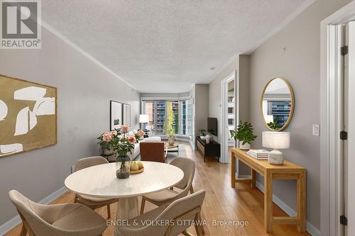 This image has been virtually staged. - 604 - 138 Somerset Street W, Ottawa, ON - Indoor Photo Showing Dining Room