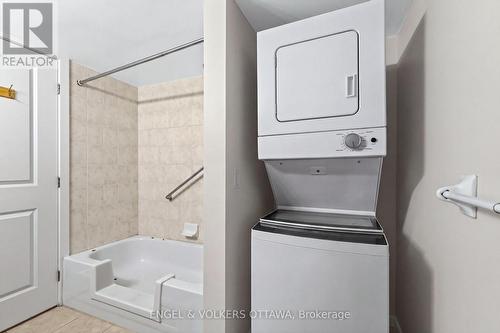 This image has been virtually staged. - 604 - 138 Somerset Street W, Ottawa, ON - Indoor Photo Showing Laundry Room