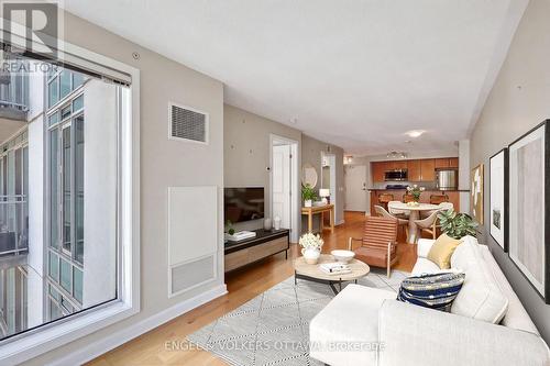 This image has been virtually staged. - 604 - 138 Somerset Street W, Ottawa, ON - Indoor Photo Showing Living Room