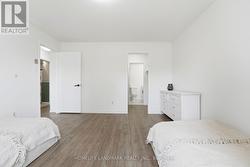 Walkin closet in master bedroom leading to bathroo - 