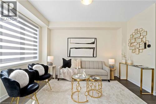 Living area featuring light-toned walls, recessed lighting, and wood-finish flooring - 10 Lemon Avenue, Thorold, ON - Indoor Photo Showing Other Room
