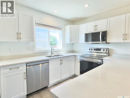 128 Westfield Road, Saskatoon, SK - Indoor Photo Showing Kitchen With Stainless Steel Kitchen With Double Sink