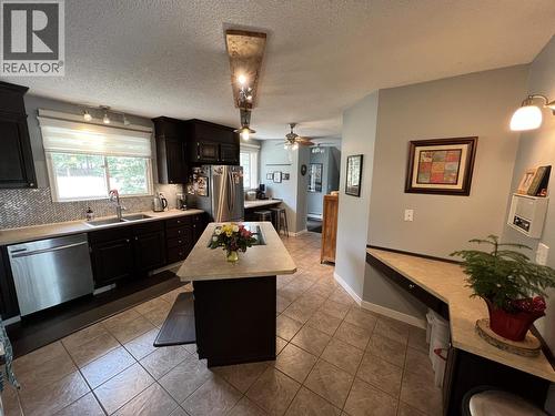 19 Raven Crescent, Fort Nelson, BC - Indoor Photo Showing Kitchen With Double Sink