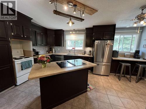 19 Raven Crescent, Fort Nelson, BC - Indoor Photo Showing Kitchen With Double Sink
