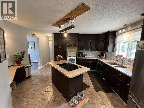 19 Raven Crescent, Fort Nelson, BC - Indoor Photo Showing Kitchen With Double Sink
