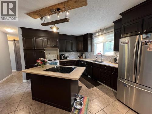 19 Raven Crescent, Fort Nelson, BC - Indoor Photo Showing Kitchen With Double Sink