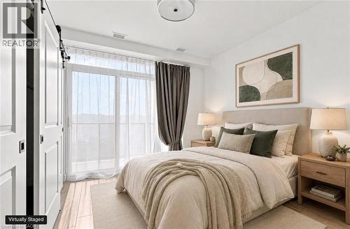 Hardwood-style flooring throughout - 50 Grand Avenue S Unit# 713, Cambridge, ON - Indoor Photo Showing Bedroom